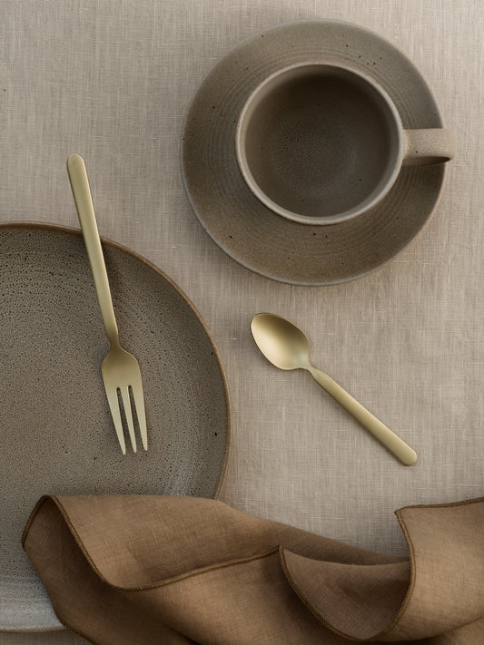 blomus KUMI Coffee Cups & Saucers 6.4 oz, Set of 2 – Fungi coffee cup and saucer with gold cutlery from above