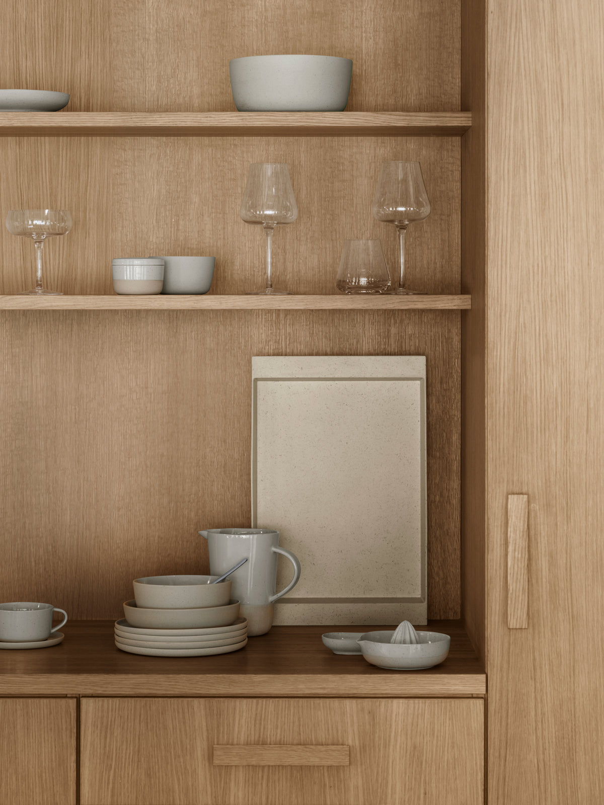 blomus BELO Red Wine Glasses 20 oz, Set of 2 – clear BELO stemware on a wooden cabinet shelf