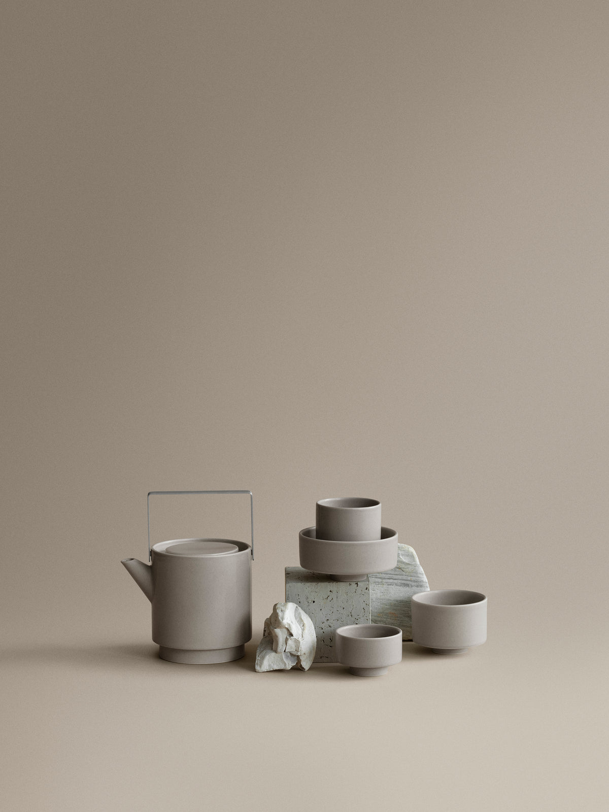 blomus MAKOTO Stoneware Bowls on a Pedestal – Elephant Skin XS bowl with cups and teapot