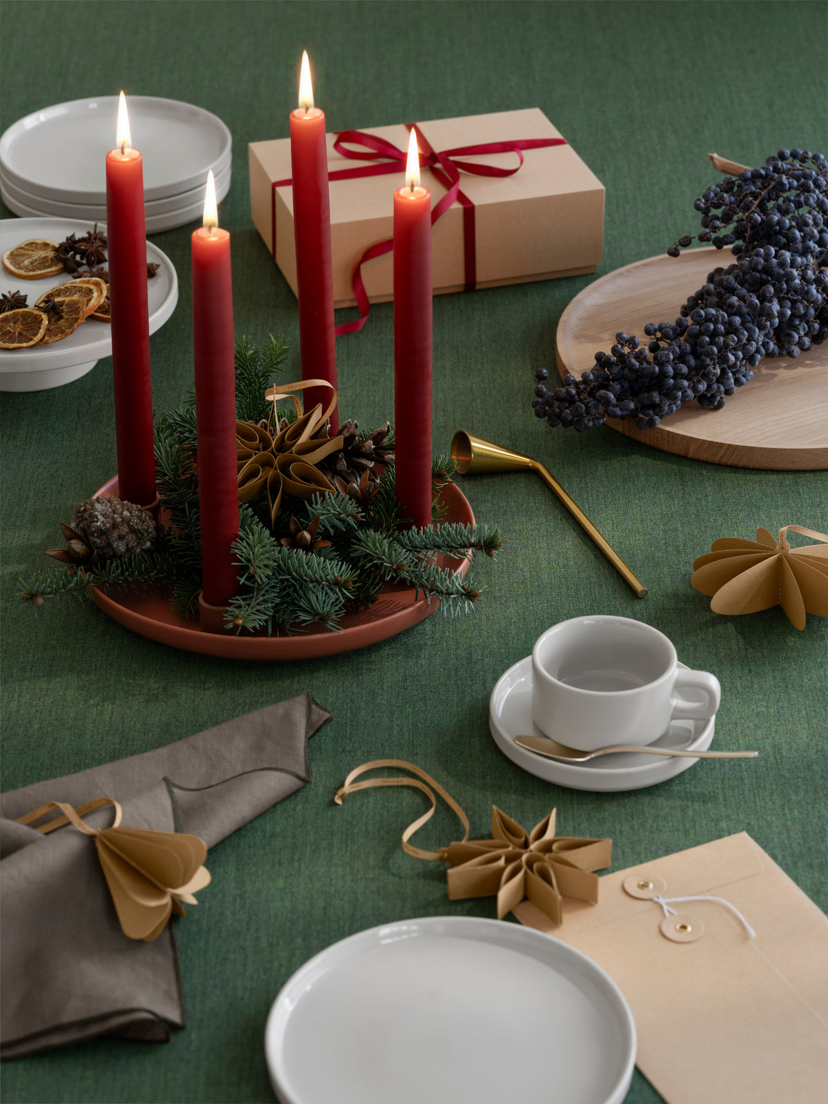 blomus PILAR Tea Cups & Saucers 6 oz, Set of 2 – Moonbeam tea cup on a green holiday table with gifts