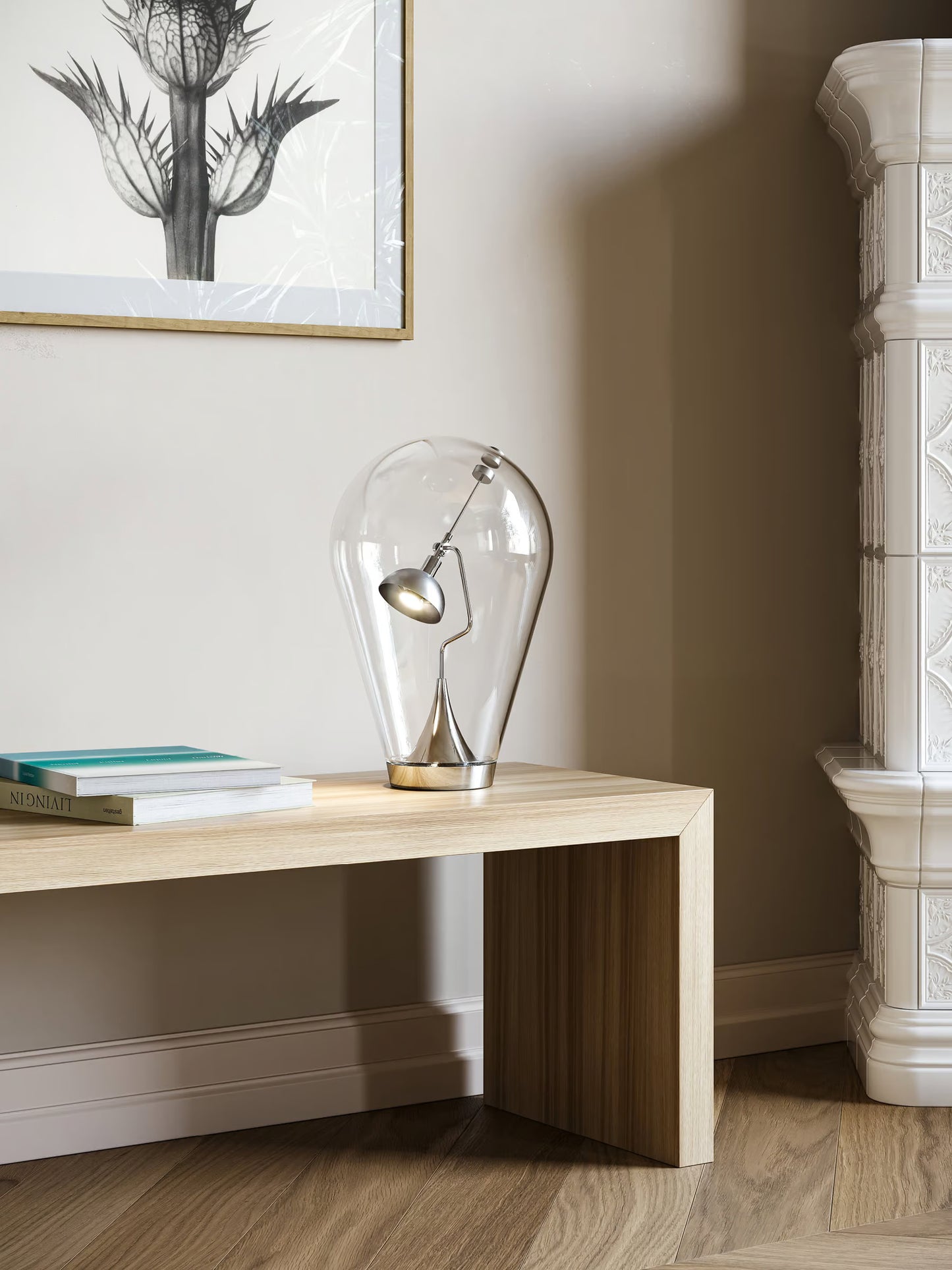 Blow table lamp by Lodes featuring clear glass and chrome finish