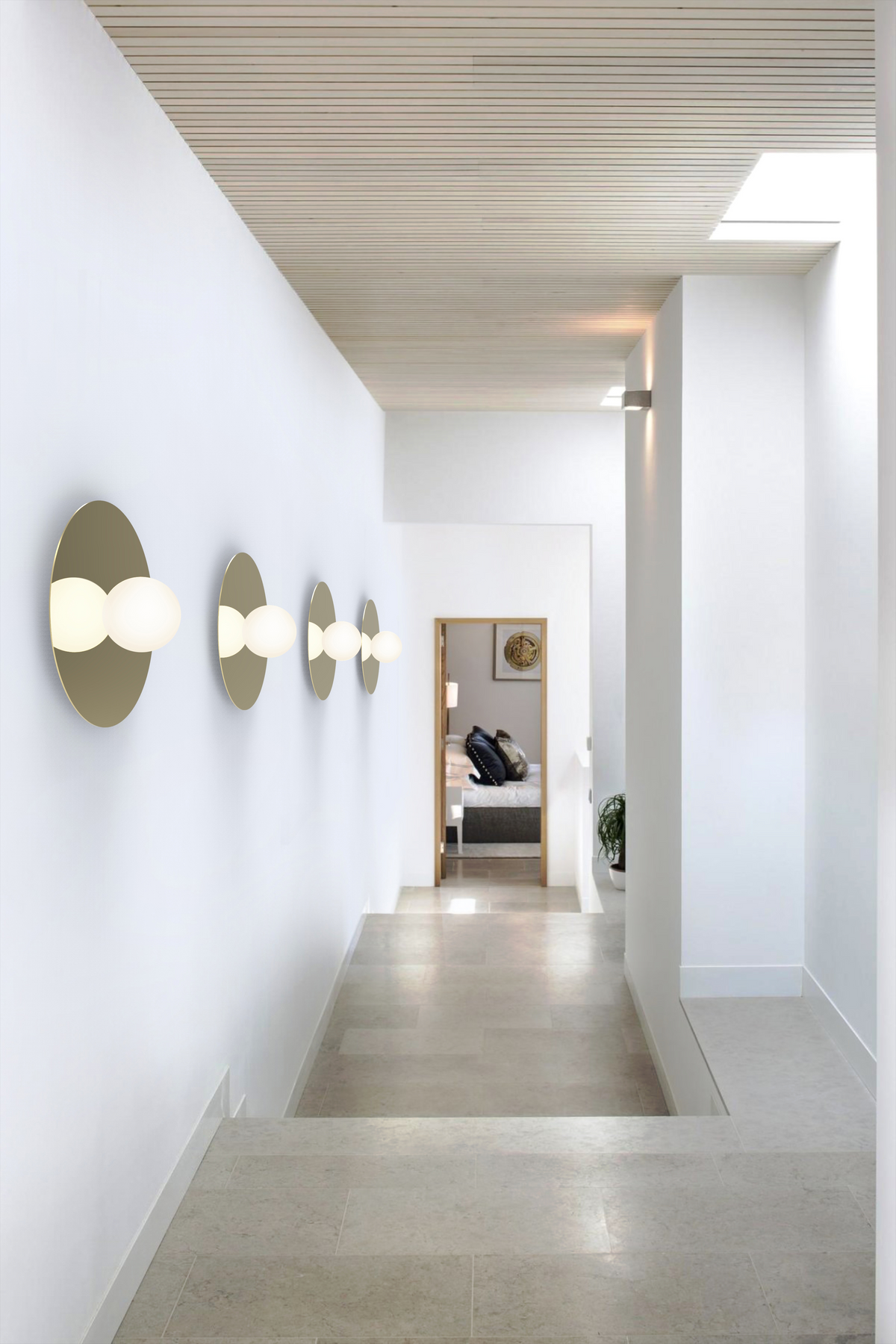 Bola Disc Colors flush mount lit in a tall room view