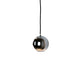 Industrial-chic Innermost Boule pendant light, durable stainless steel construction for modern loft apartments or bar areas.