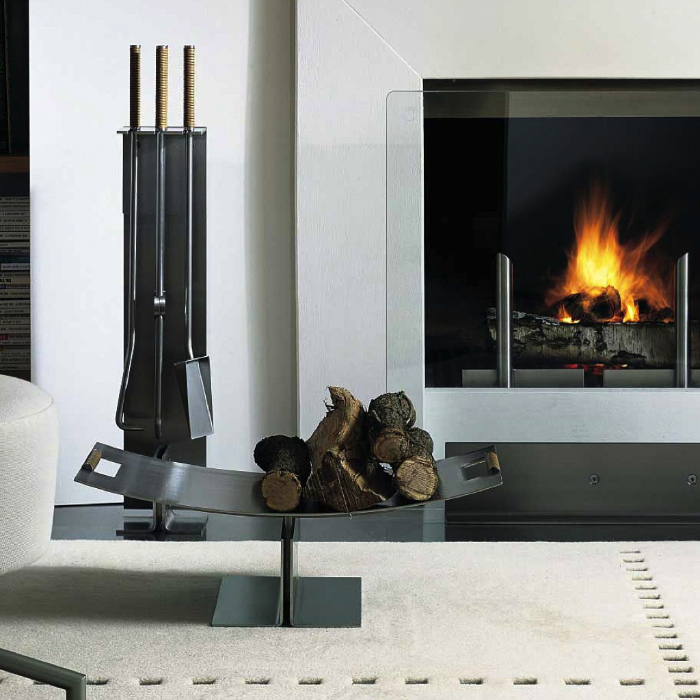 Peter Maly Fireside Tools with Floor Stand by Conmoto – beside a fireplace with a log holder