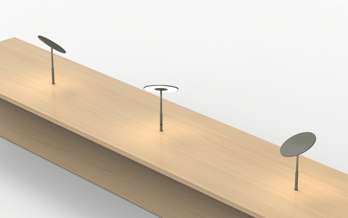 Circa disc lamp on a home office desk