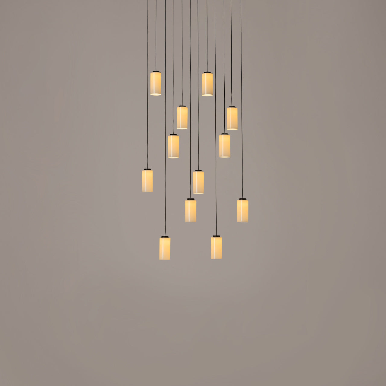 Cirio Cascada 12-light hanging LED pendant designed by Antoni Arola with porcelain and brass shade options