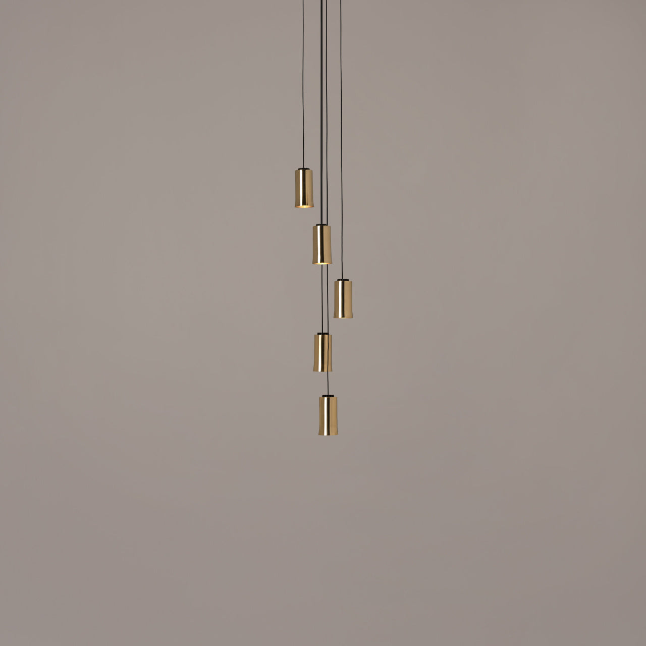 Modern Cirio Cascada multi-pendant light by Santa & Cole Spain with warm LED lighting for contemporary living spaces in polished brass shade
