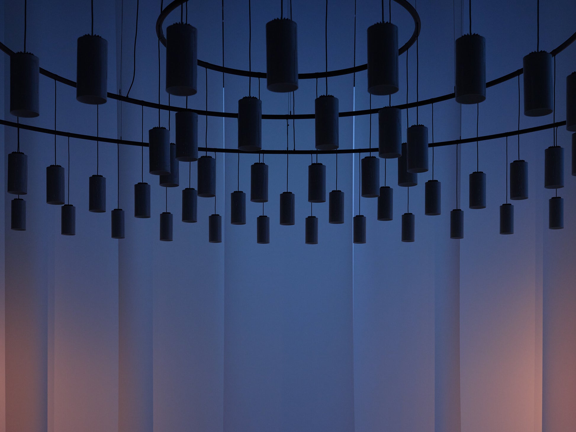 Warm white architectural pendant lighting for modern commercial spaces