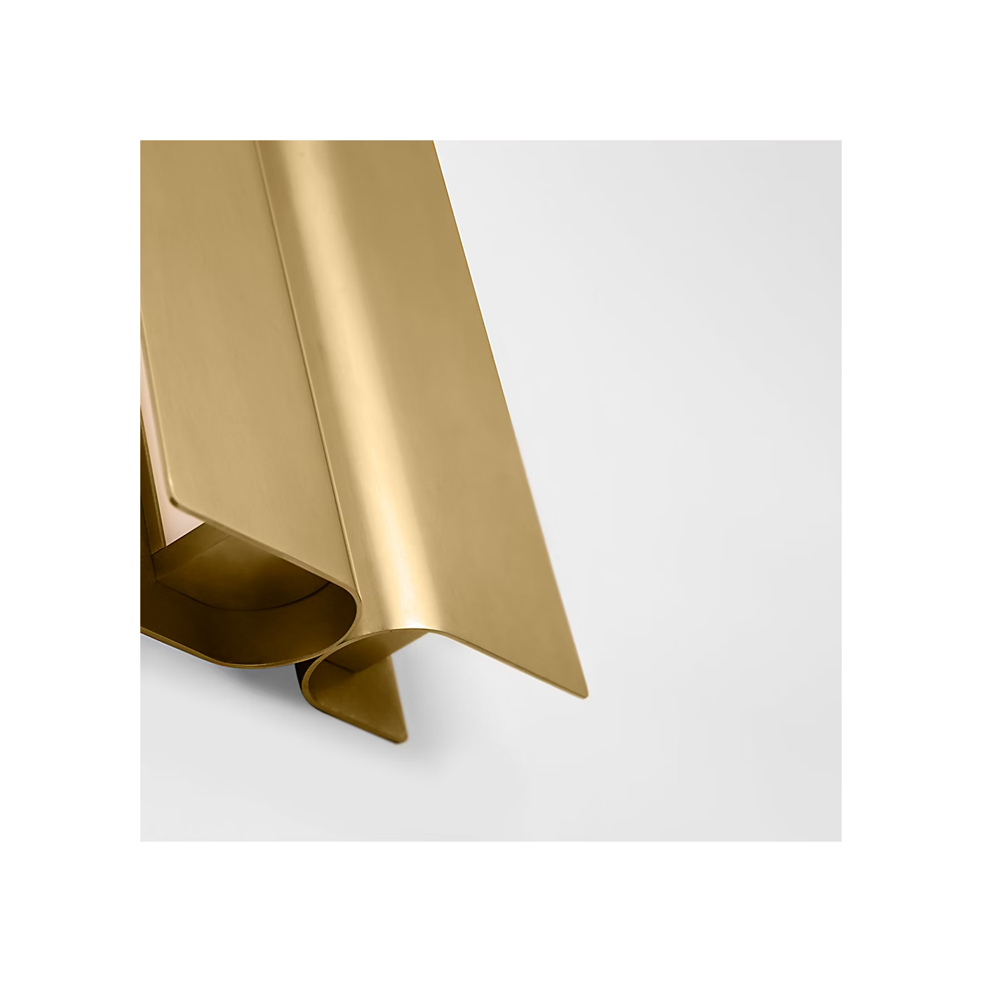 Cloak 18 wall vanity light antique brass finish installed beside mirror