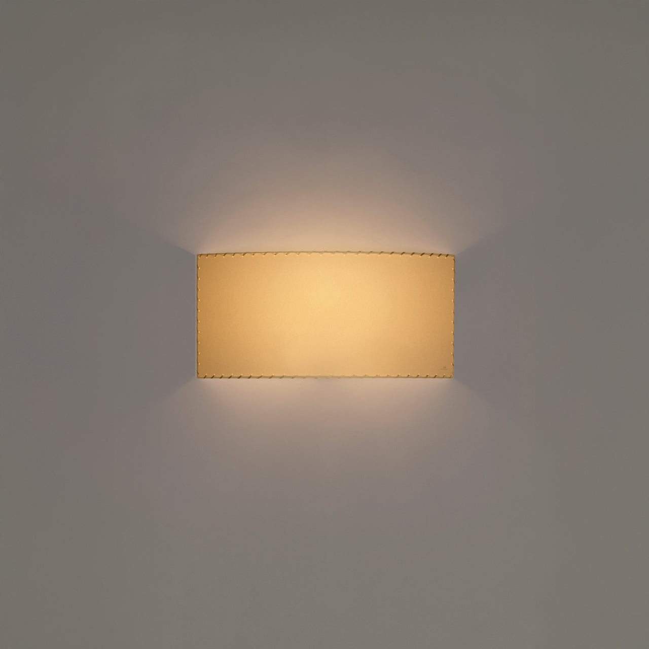 Comodin Rectangular Wall Lamp by Santa & Cole in Stitched Beige Parchment finish with warm ambient lighting