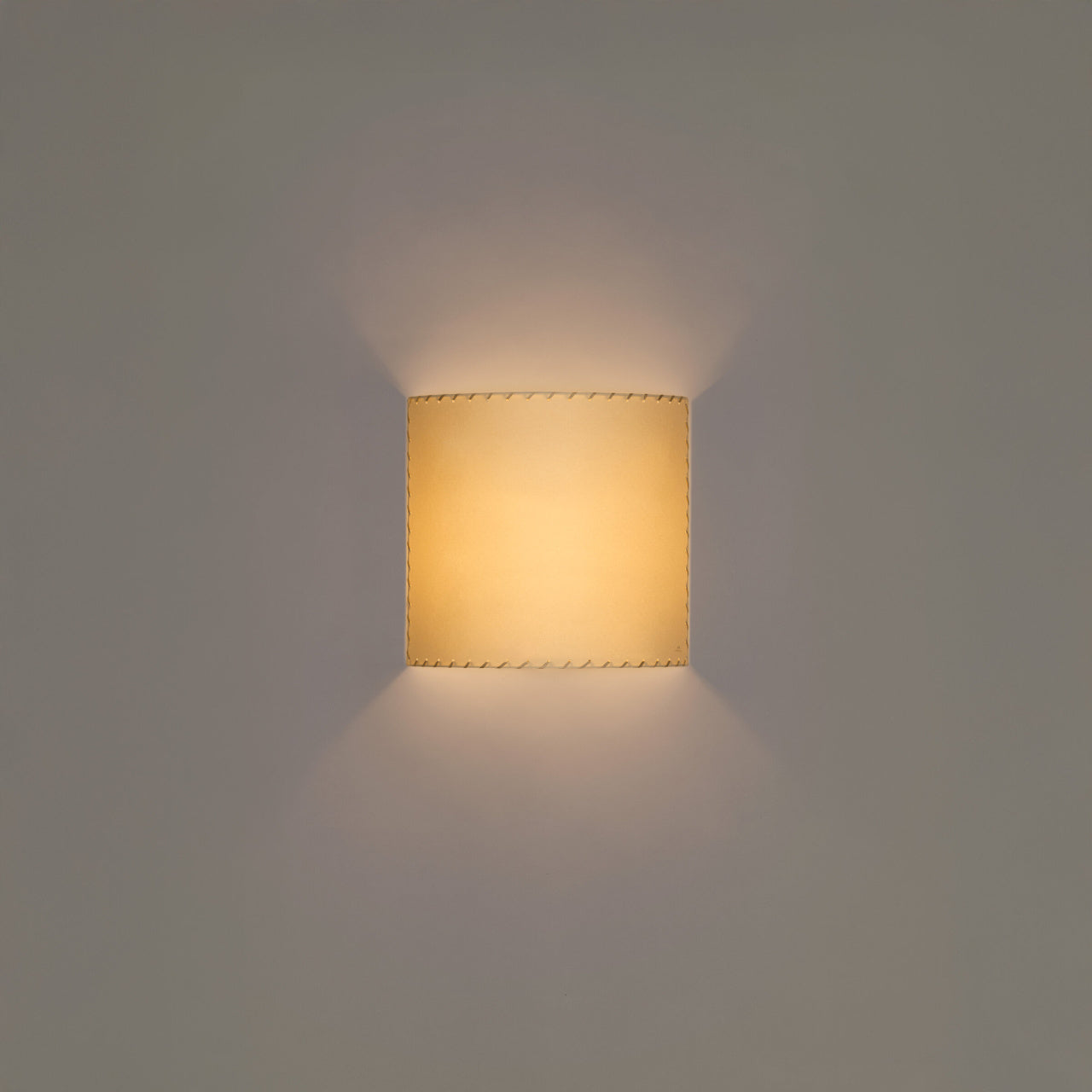 Contemporary Comodin square wall sconce in stitched beige parchment finish
