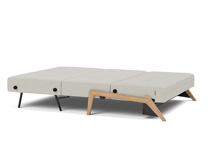Compact full size sofa bed with oak wood legs in 527 Mixed Dance Natural upholstery