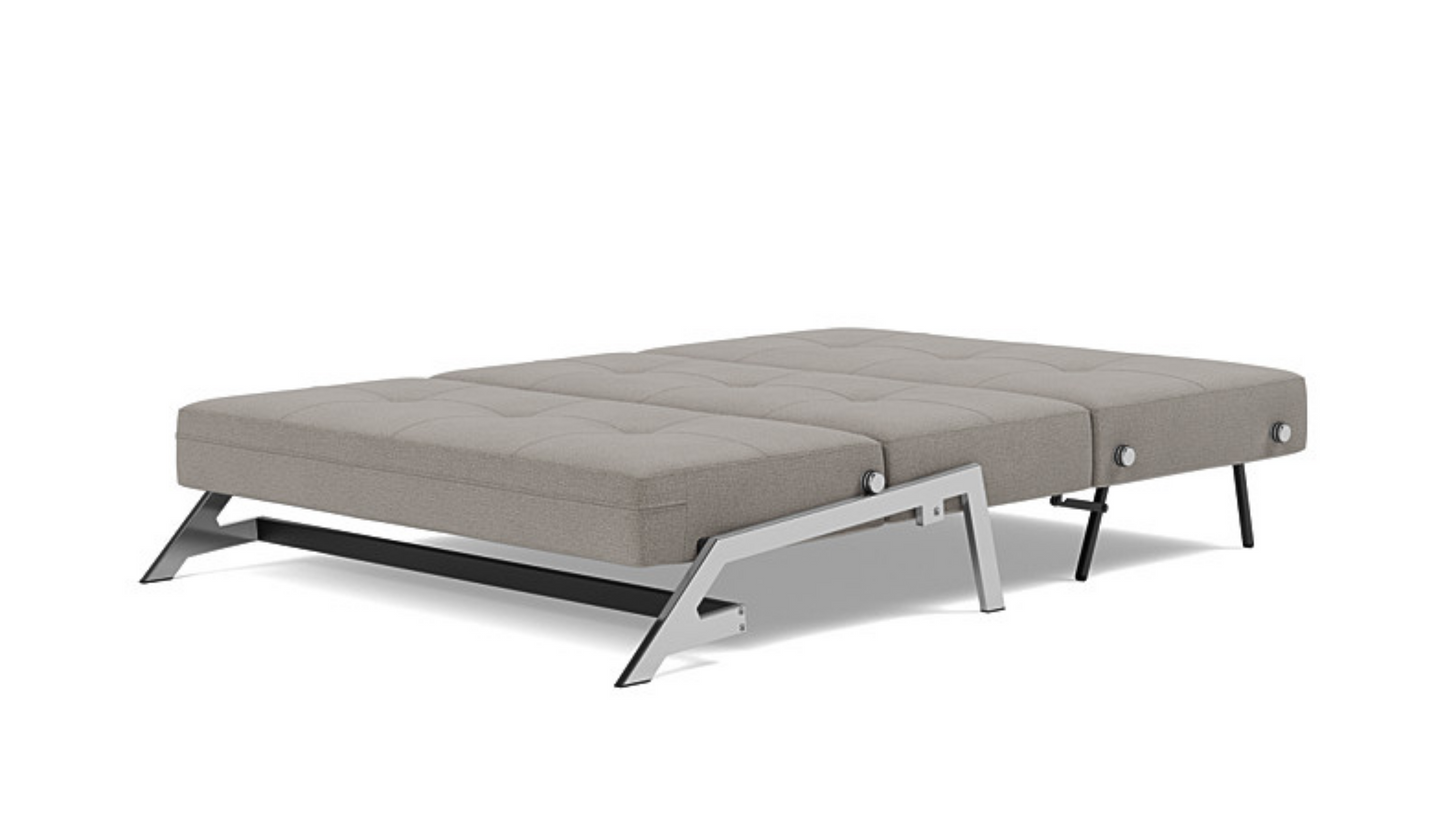 Cubed sleeper sofa showing hidden bedding storage compartment