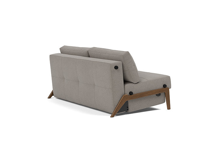 Side profile of the Innovation Living Cubed Queen sofa bed with dark wood legs