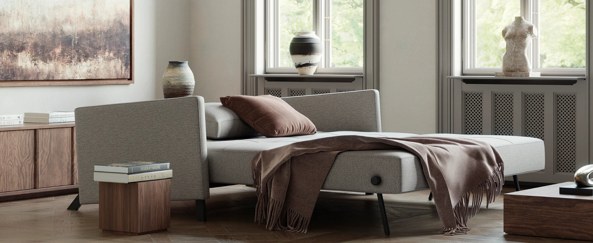 Modern upholstered sofa for apartments and multifunctional spaces