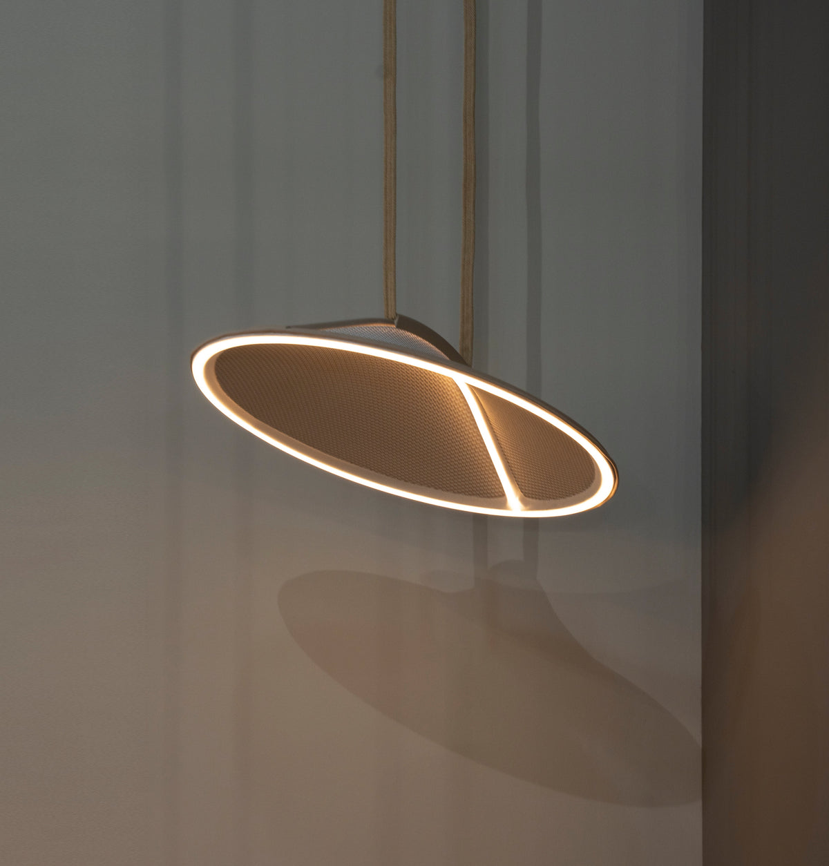 Pantaya mesh pendant installed in a furnished interior