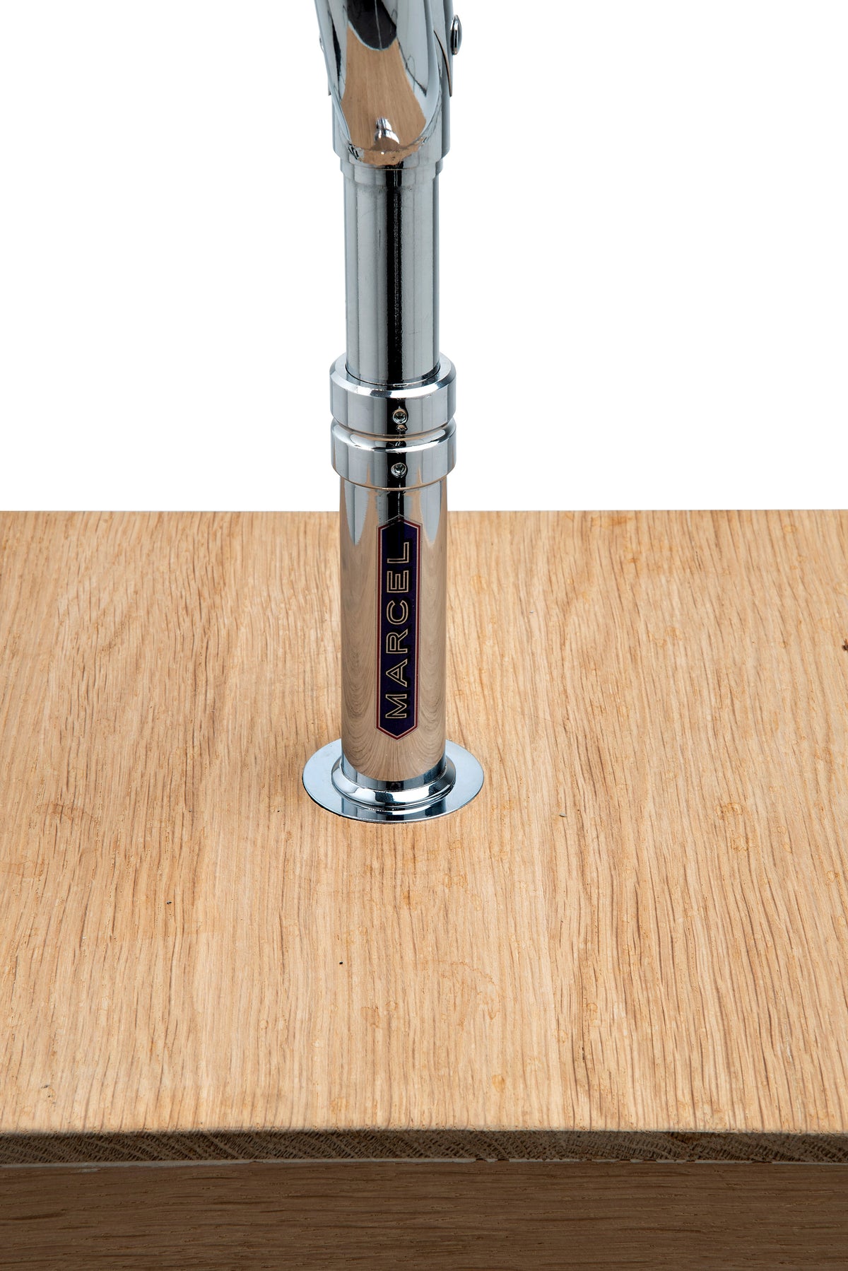 Cyclampa Marcel detail, chrome fork with Marcel badge set into oak