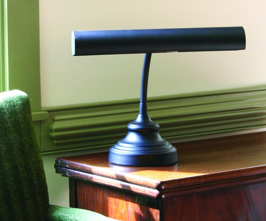 House of Troy Advent 14" Piano & Desk Lamp, Weighted Base in Black in a room setting