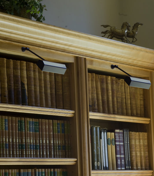 House of Troy Library 10" Direct Wire Wall Lamp in Oil Rubbed Bronze in a room setting
