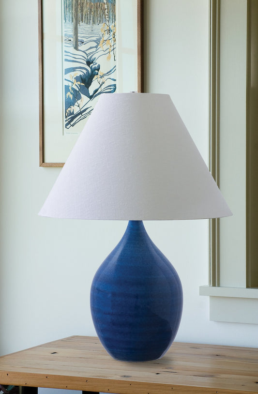 House of Troy Scatchard 22.5" Stoneware Table Lamp, Style GS300 in Blue Gloss in a room setting