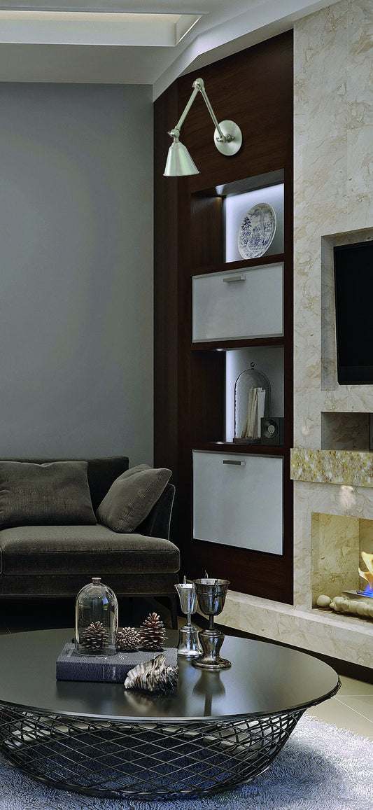 House of Troy Library Adjustable LED Wall Lamp in Satin Nickel in a room setting