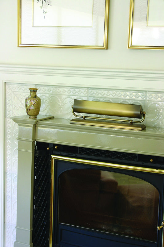 House of Troy Mantel 14" Uplight in Antique Brass in a room setting