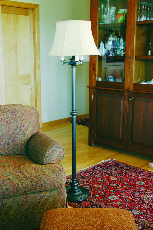 House of Troy Newport 66" Six-Way Floor Lamp in Oil Rubbed Bronze in a room setting