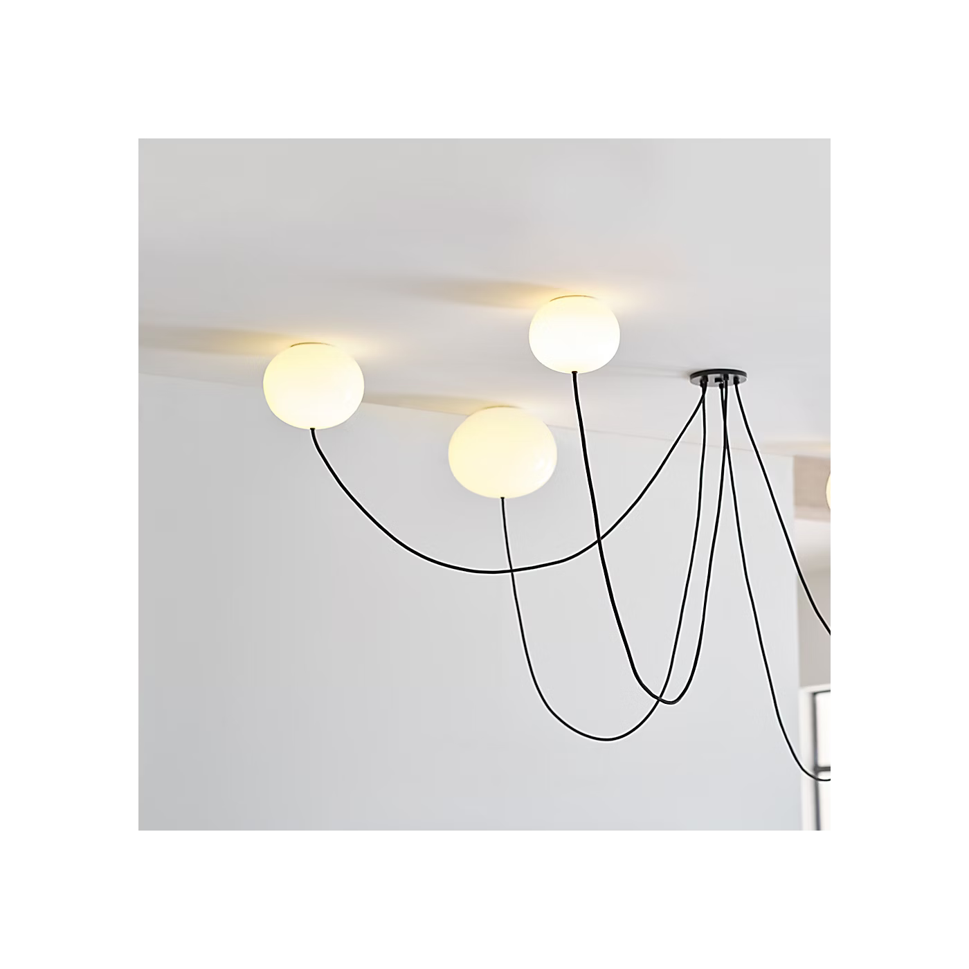 Black modern chandelier with white glass globes for luxury interiors