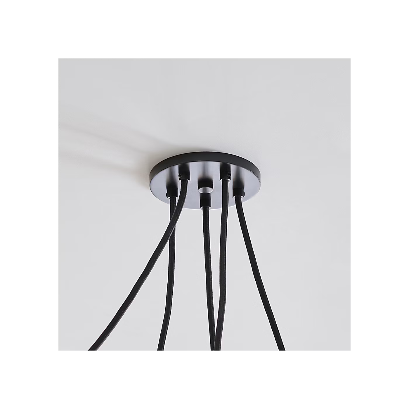 Large modern chandelier with etched glass shades and black cable suspension