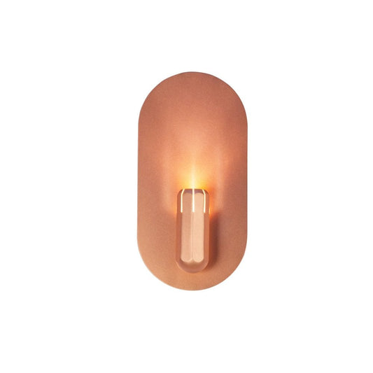 Innermost Brixton copper wall sconce, dimmable LED up-lighter for modern bedroom ambient lighting.