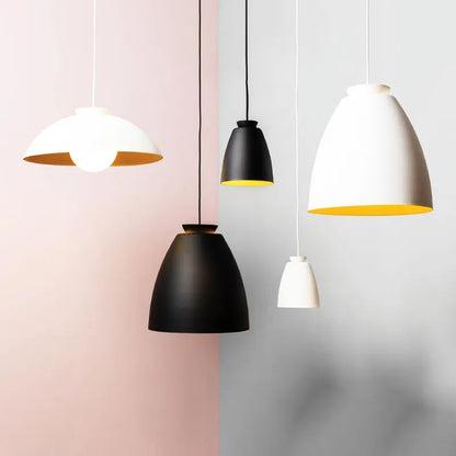 Set of modern pendant lights in various colors on a gradient background