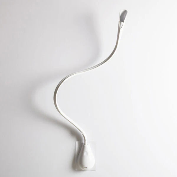 White leather Cobra LED wall light by Innermost, showcasing its flexible arm and integrated USB charging.