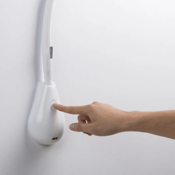 Close-up of Innermost Cobra wall lamp in white leather with a seamless white inner hood, ideal for modern bedrooms.