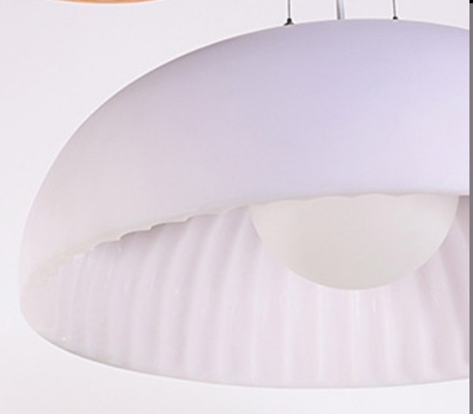 James Bartlett designed Doric 60 pendant in a contemporary office setting, highlighting its sleek, architectural form in solid white.