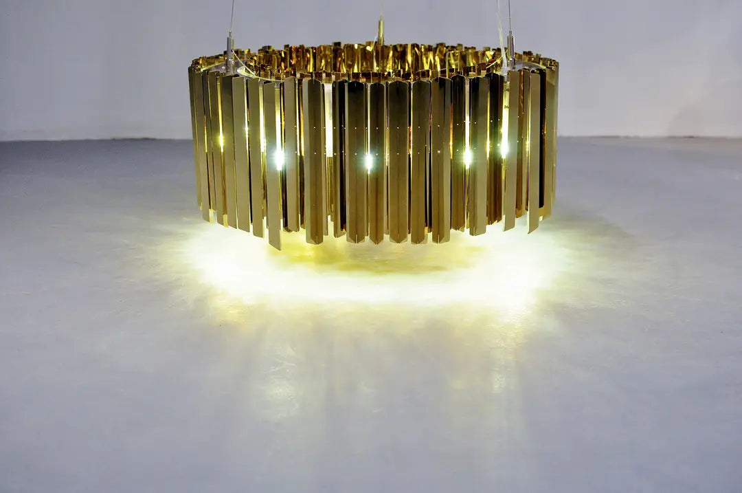 Elegant metal chandelier casting soft diffused light in office space