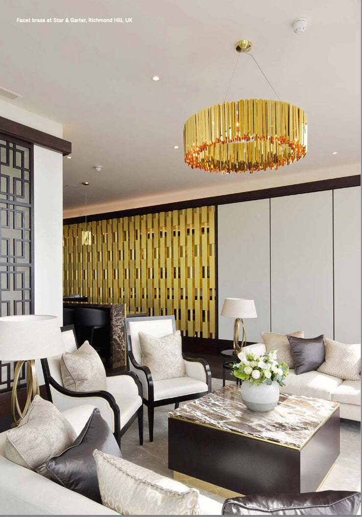 Unique mirrored stainless steel chandelier creating fragmented reflections