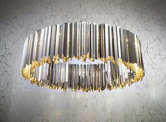 Innermost Facet 100 stainless steel chandelier in modern living room in stainless steel