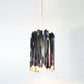 Tom Kirk designed Innermost Facet 18 mini pendant, a unique G9 bulb compatible fixture, perfect for compact spaces and hallways.
