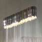 Unique polished metal pendant light with crystal-like visual effect. 