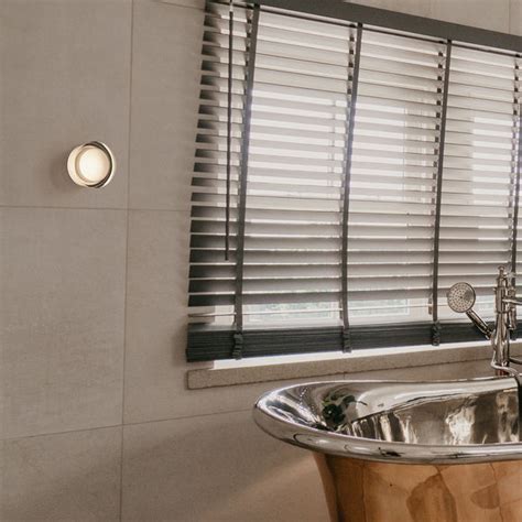 White aluminum flush mount LED luminaire for minimalist commercial office lighting.