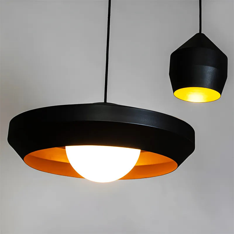 Close-up of Hoxton pendant light with gold interior and black exterior