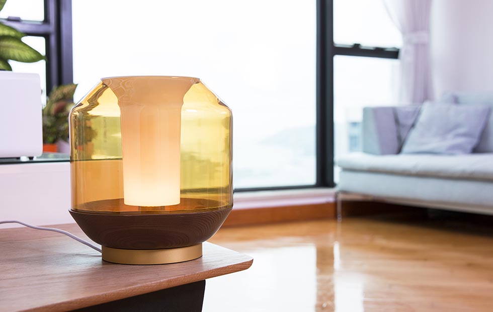 Amber glass table lamp with wood base for modern bedroom lighting