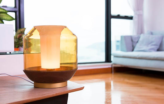 Amber glass table lamp with wood base for modern bedroom lighting