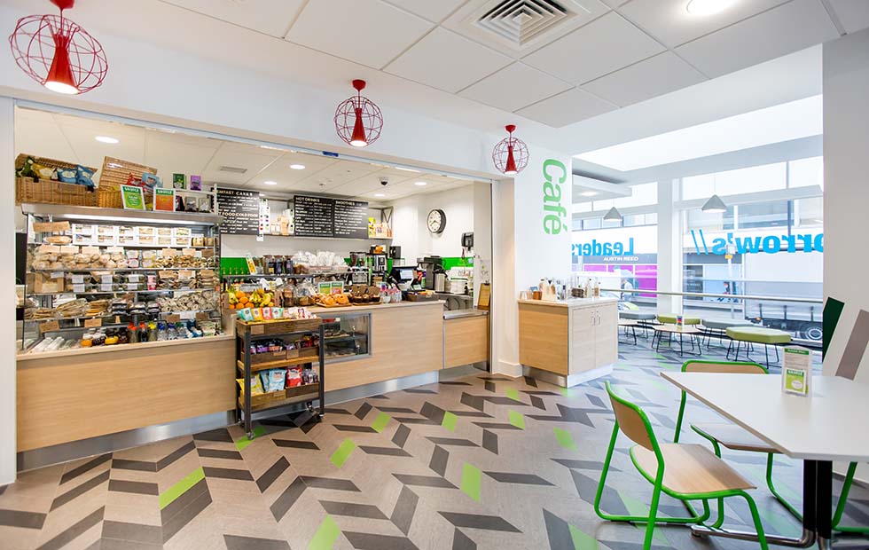 Contemporary LED ceiling fixture for offices and hospitality spaces installed in a grocery store