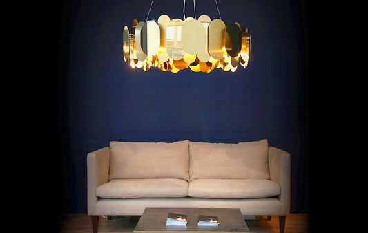 Innermost Panel 115 chandelier by Steve Jones – Brass over a sofa