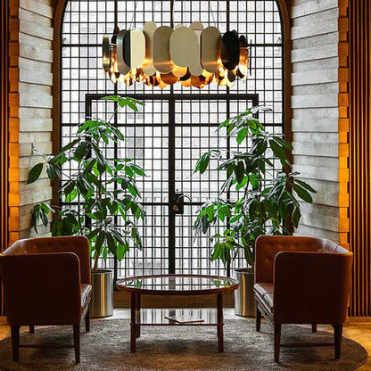 Panel 75 brass suspension light by Steve Jones for Innermost in modern dining room