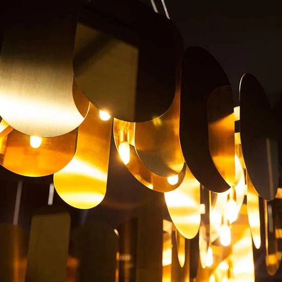 Modern brass statement chandelier with layered stainless steel discs