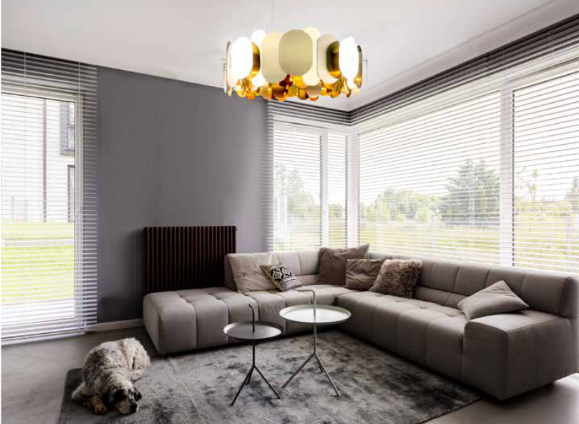 Brass finish Panel 75 designer chandelier hanging above living room