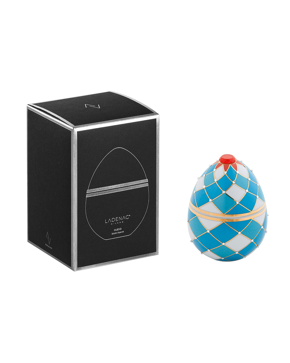 Bois de Russie 220 g ceramic egg candle by Ladenac Milano, Harlequin Blue egg beside its black gift box
