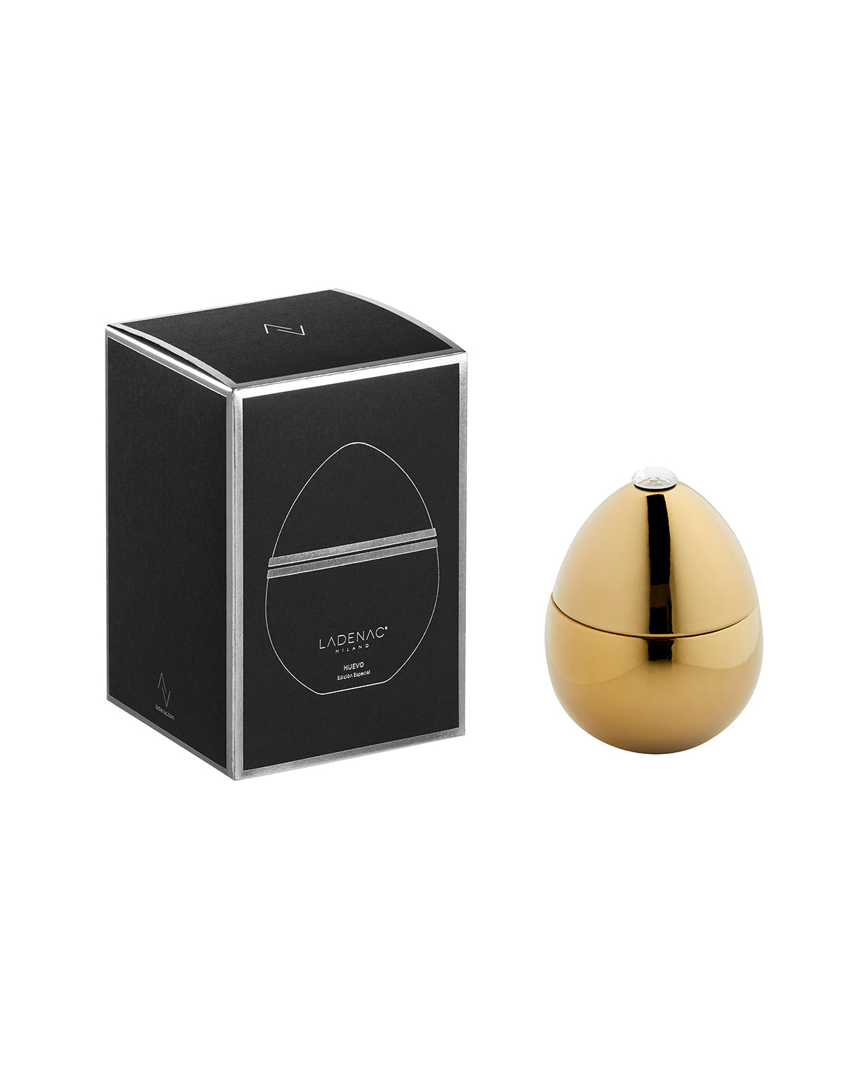 Bois de Russie 220 g ceramic egg candle by Ladenac Milano, Gold egg beside its black gift box